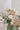 Small wedding table decor of three bud vases in soft blush, pink and cream tones from award winning wedding florist The Flower Lounge in Manchester.